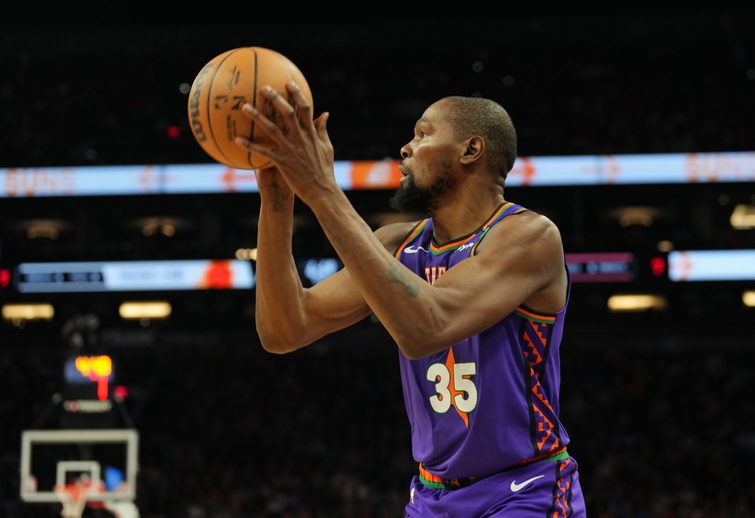 Phoenix Suns forward Kevin Durant (35) takes a shot against the Detroit Pistons during the first half at Footprint Center on December 21, 2024.