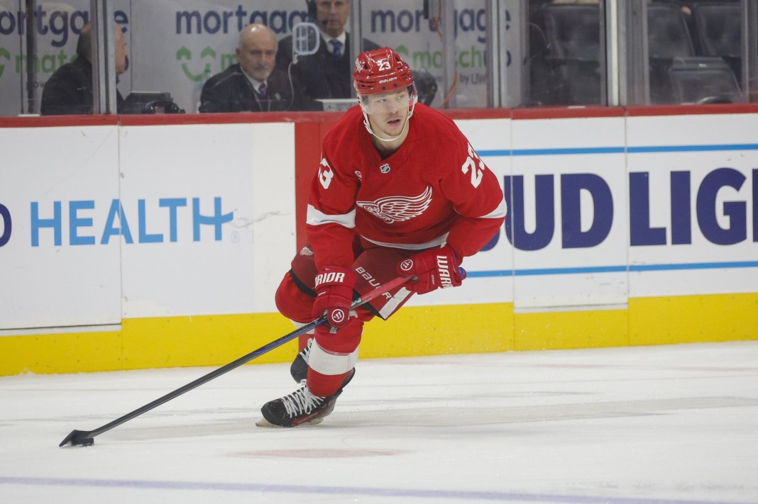 Detroit Red Wings left wing Lucas Raymond handles the puck against the Colorado Avalanche