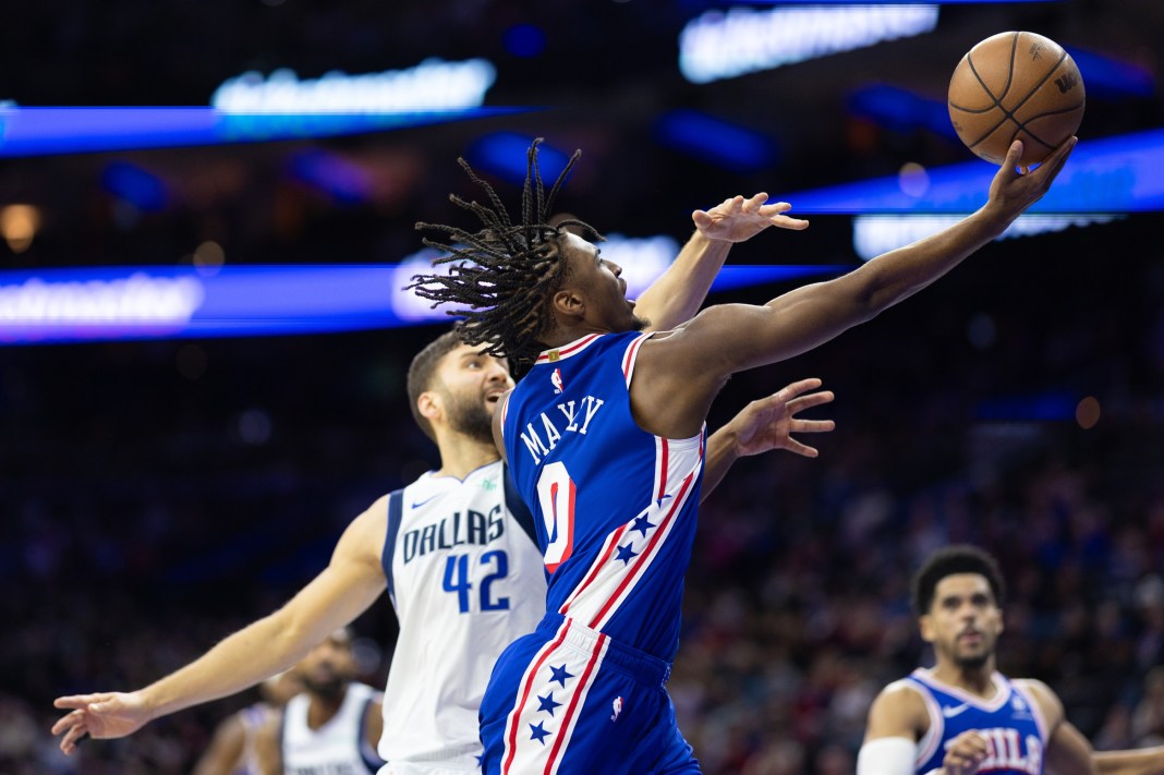 Philadelphia 76ers guard Tyrese Maxey (0) drives for a shot past Dallas Mavericks forward Maxi Kleber (42)