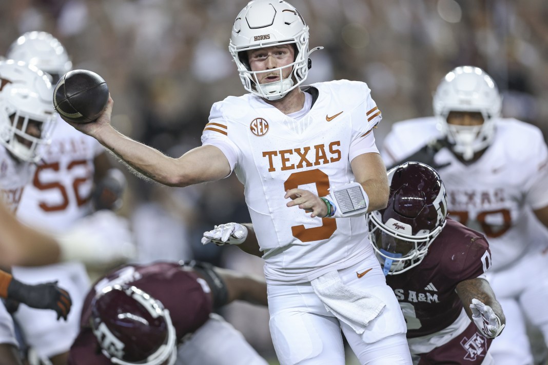 Texas star Quinn Ewers looks to make a throw against Texas A&M during the 2024 college football season.