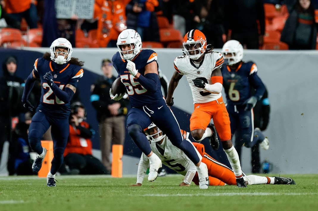 Denver Broncos linebacker Cody Barton runs back an interception against Cleveland Browns quarterback Jameis Winston