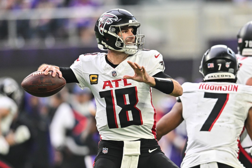 Falcons quarterback Kirk Cousins throws a pass against the Vikings during the 2024 NFL season.