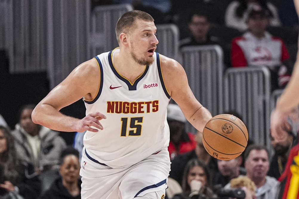 Nuggets superstar Nikola Jokic brings the ball up in a game against the Hawks during the 2024-25 NBA season.