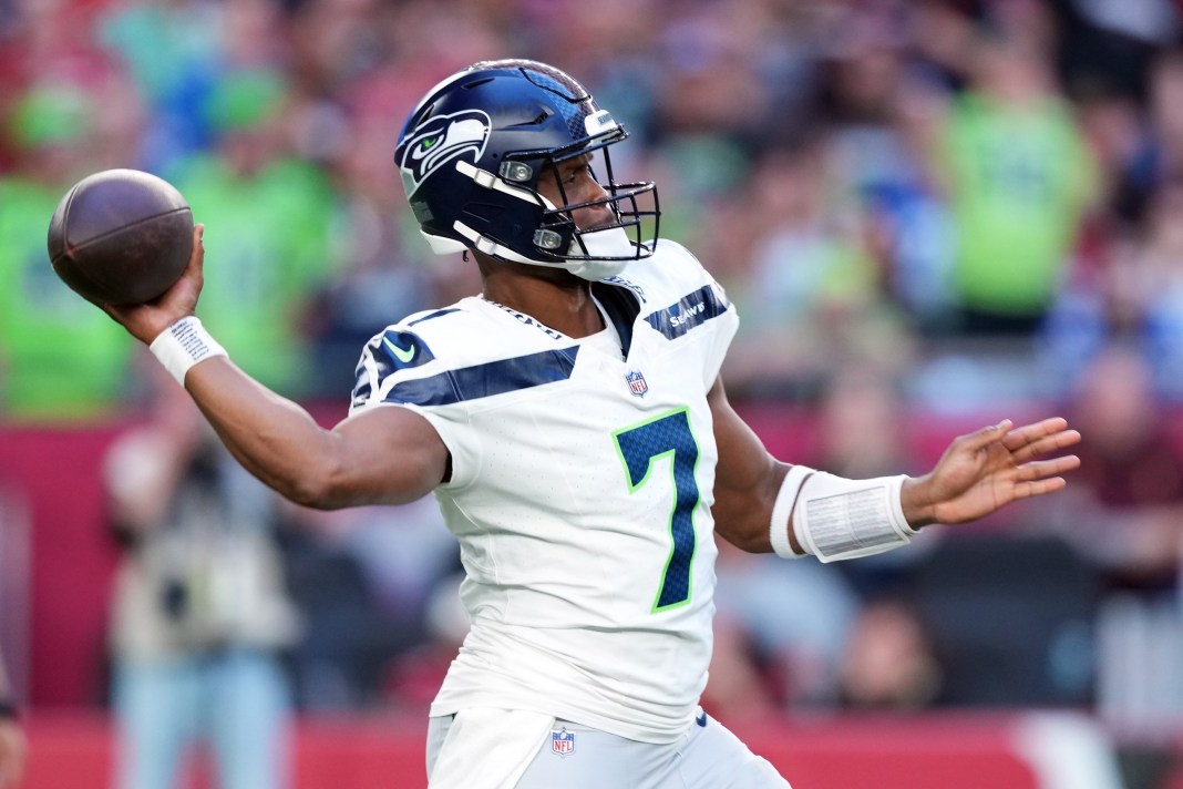 Seahawks quarterback Geno Smith throws a pass against the Cardinals during the 2024 NFL season.