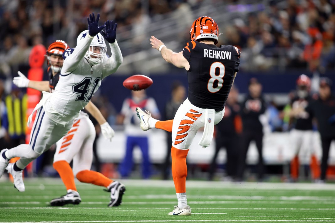 Dallas Cowboys linebacker Nick Vigil blocks a punt by Cincinnati Bengals punter Ryan Rehkow