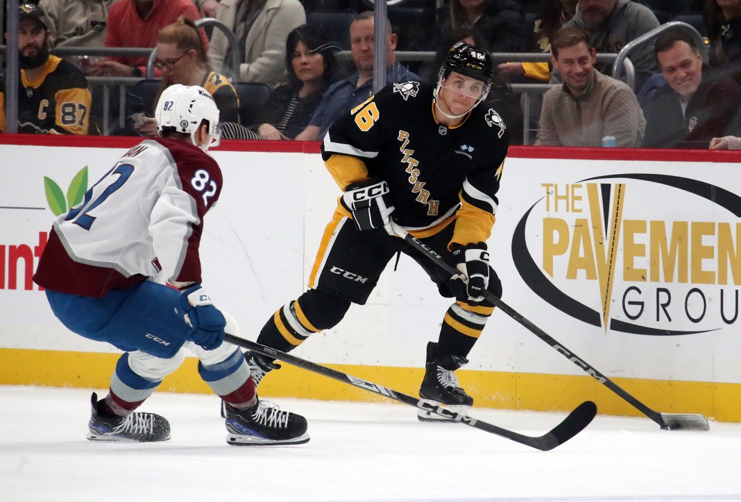 Pittsburgh Penguins center Blake Lizotte moves the puck against Colorado Avalanche center Ivan Ivan