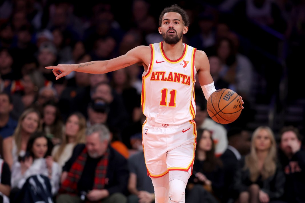 Hawks star Trae Young directs traffic in an NBA Cup meeting with the Knicks during the 2024-25 NBA season.