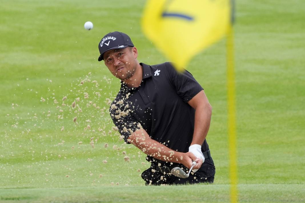 Xander Schauffele hits from the bunker onto the green of the seventh hole during the second round of the PGA Championship at Valhalla Golf Club on May 17, 2024.