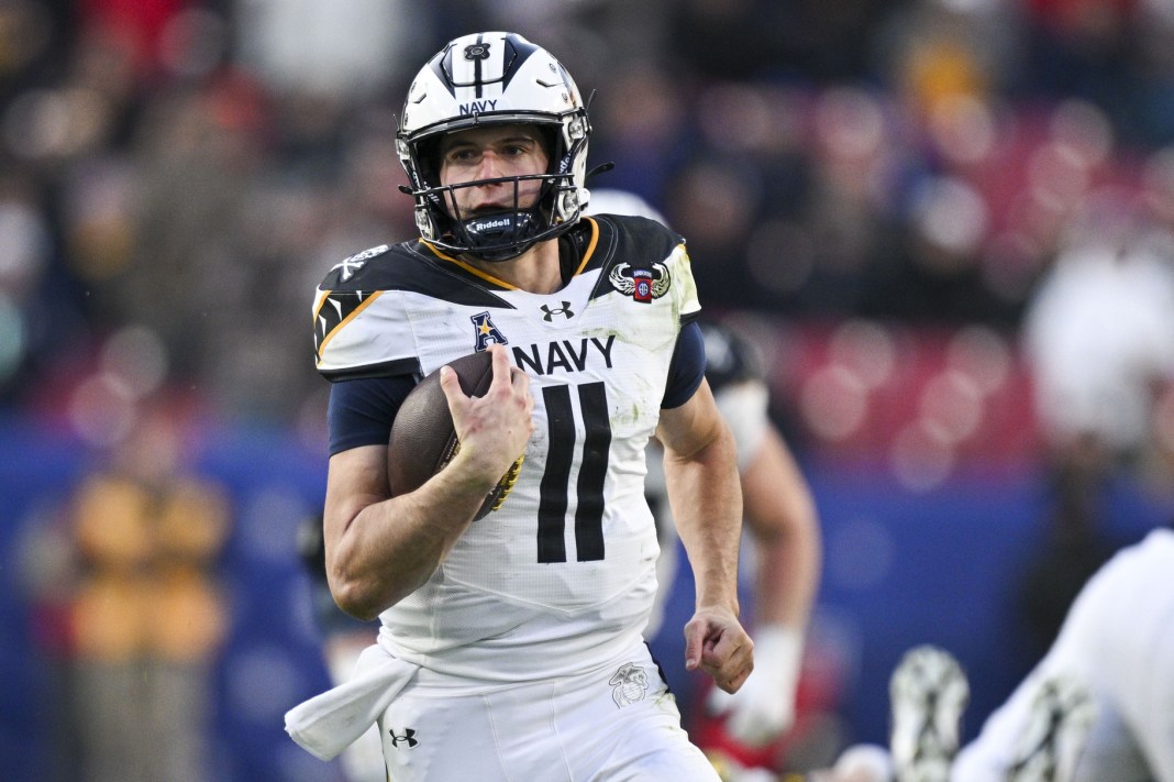 Navy quarterback Blake Horvath runs against Army during the 2024 college football season.