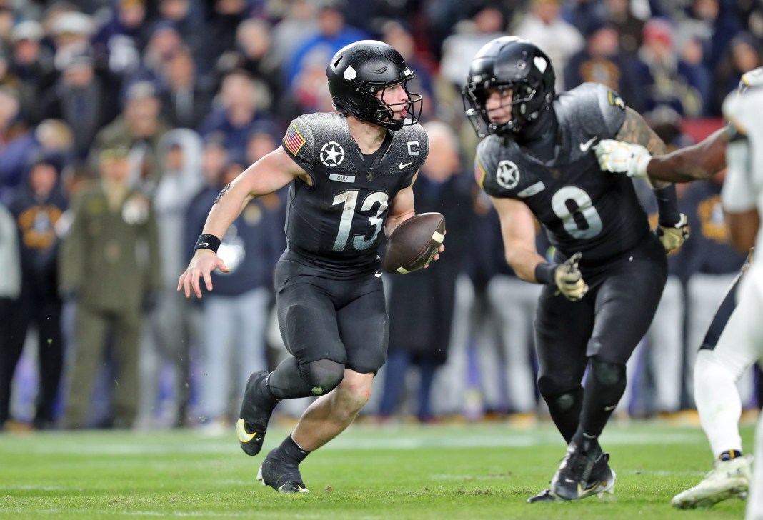 Army Black Knights quarterback Bryson Daily looks to pitch the ball against the Navy Midshipmen during the second half of the the 125th Army-Navy game