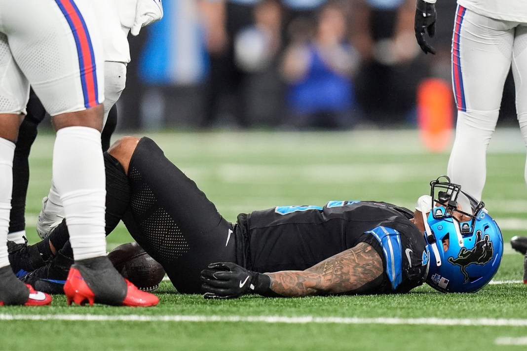 Detroit Lions running back David Montgomery (5) lays on the field after a play against the Buffalo Bills