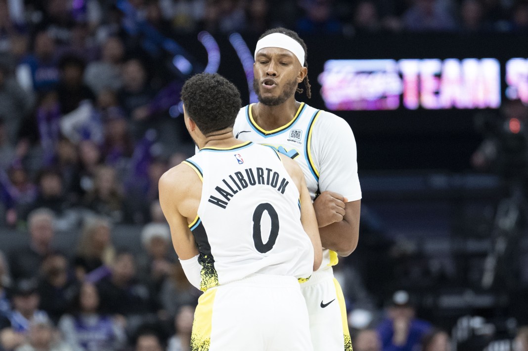 Pacers players Tyrese Haliburton and Myles Turner celebrate a big play against the Kings during the 2024-25 NBA season.