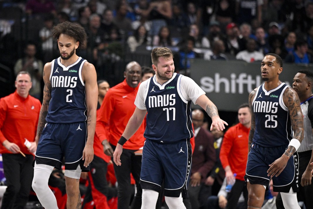 Mavericks superstar Luka Doncic walks with his teammates in a game against the Blazers during the 2024-25 NBA season.