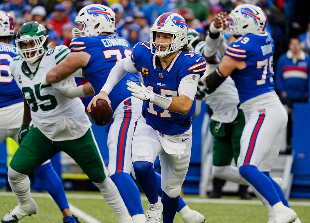 Buffalo Bills quarterback Josh Allen (17) runs for an eight-yard gain during the first half of the game against the New York Jets at Highmark Stadium on December 29, 2024.