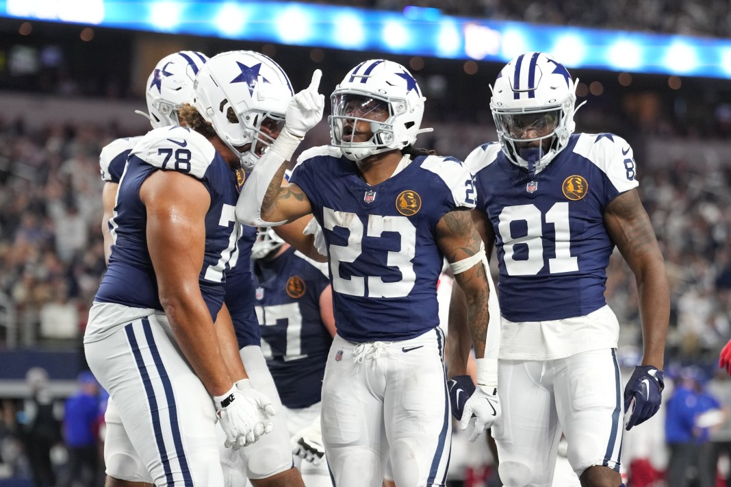 Dallas Cowboys running back Rico Dowdle celebrates with teammates after scoring a touchdown against the New York Giants