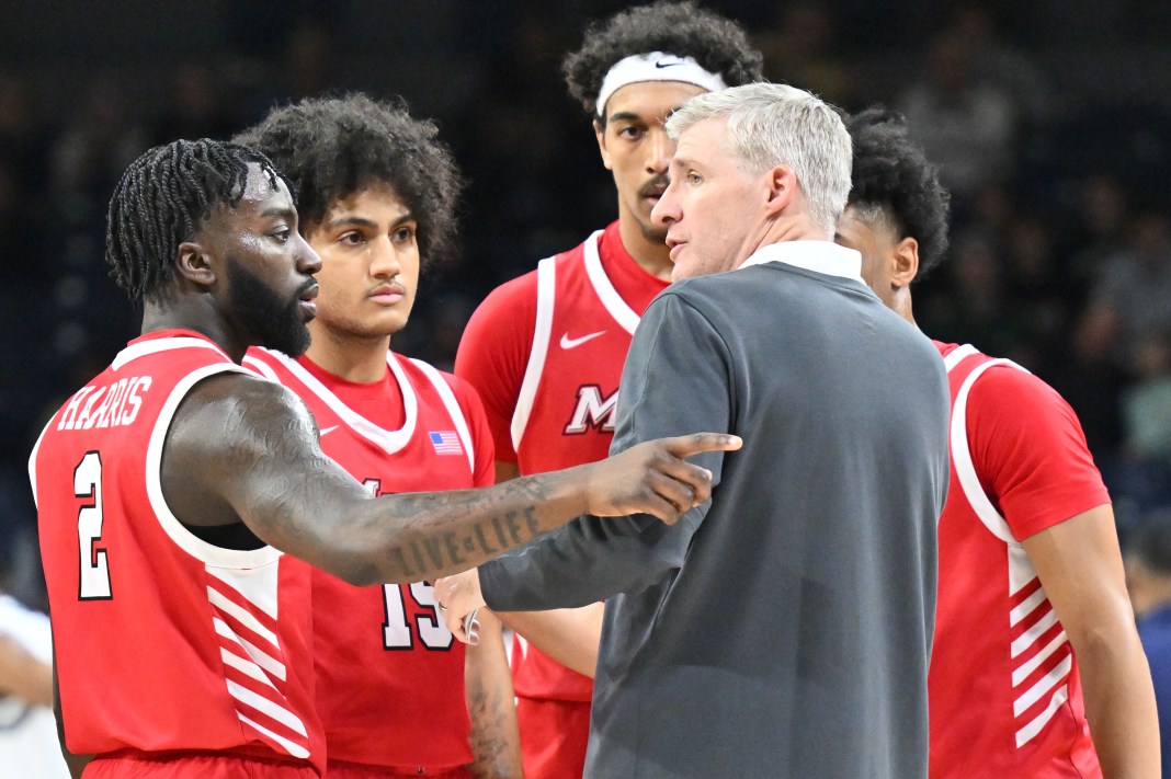 Marist Red Foxes head coach John Dunne talks to his players in the second half against the Notre Dame Fighting Irish