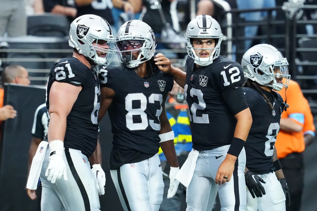 Las Vegas Raiders wide receiver Kristian Wilkerson celebrates with guard Jordan Meredith and quarterback Aidan O'Connell