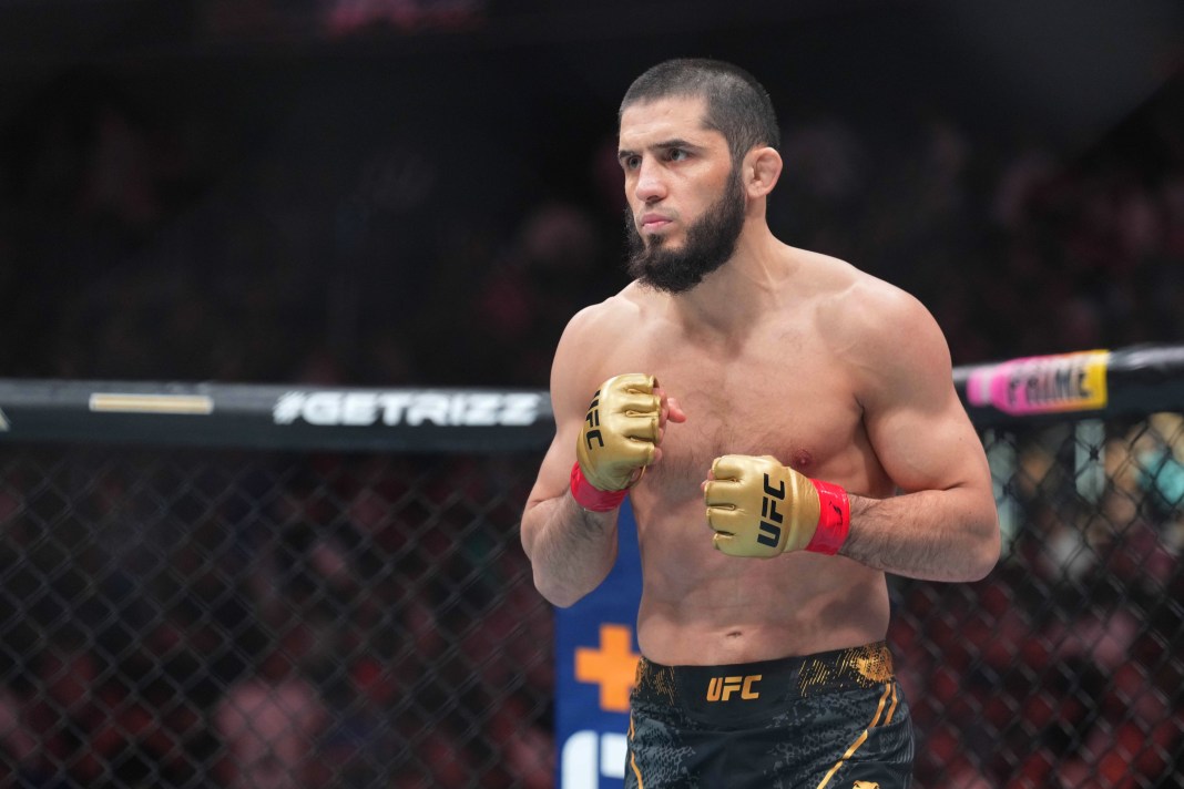 Islam Makhachev (red gloves) fights Dustin Poirier (blue gloves) during UFC 302 at Prudential Center in Newark, New Jersey, on June 1, 2024.