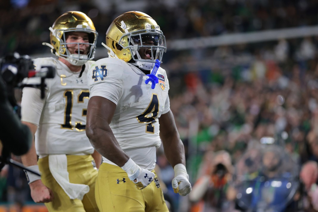 Notre Dame Fighting Irish running back Jeremiyah Love (4) celebrates a touchdown during the second half against the Penn State Nittany Lions in the Orange Bowl at Hard Rock Stadium on January 9, 2025.