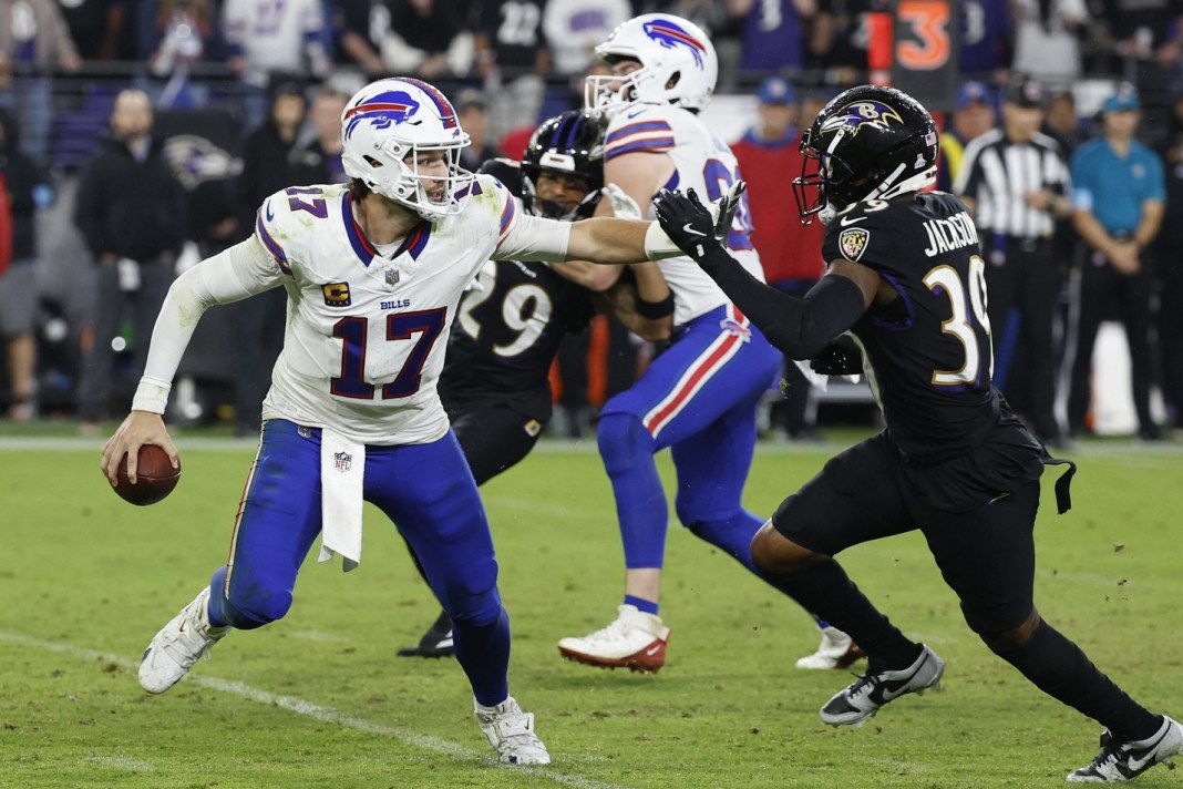 Buffalo Bills quarterback Josh Allen (17) scrambles away from Baltimore Ravens safety Eddie Jackson (39) at M&T Bank Stadium on September 29, 2024