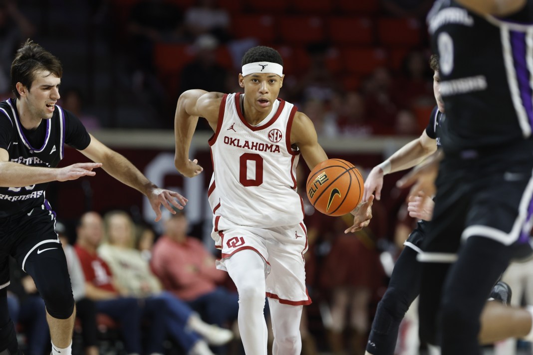 Oklahoma Sooners guard Jeremiah Fears (0) drives to the basket against Central Arkansas Bears forward Diogo Seixas (23) during the second half at Lloyd Noble Center on December 22, 2024.