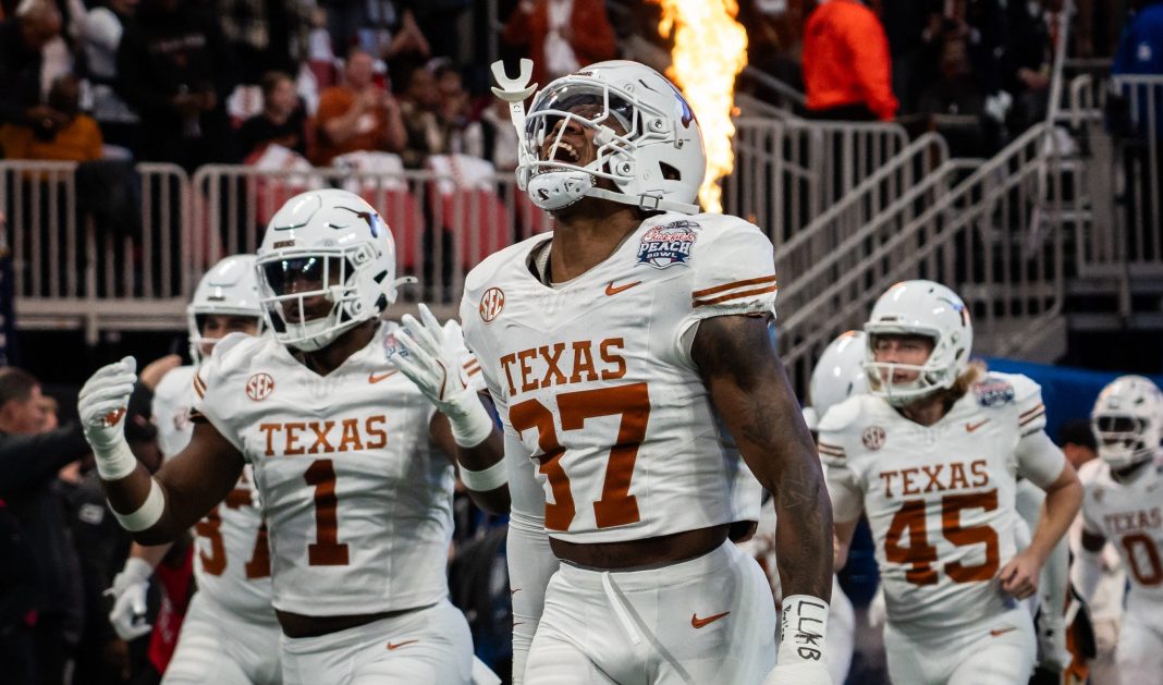 Texas Longhorns linebacker Morice Blackwell Jr. (37) leads his team onto the field before the Peach Bowl College Football Playoff quarterfinal against the Arizona State Sun Devils at Mercedes-Benz Stadium on January 1, 2025.