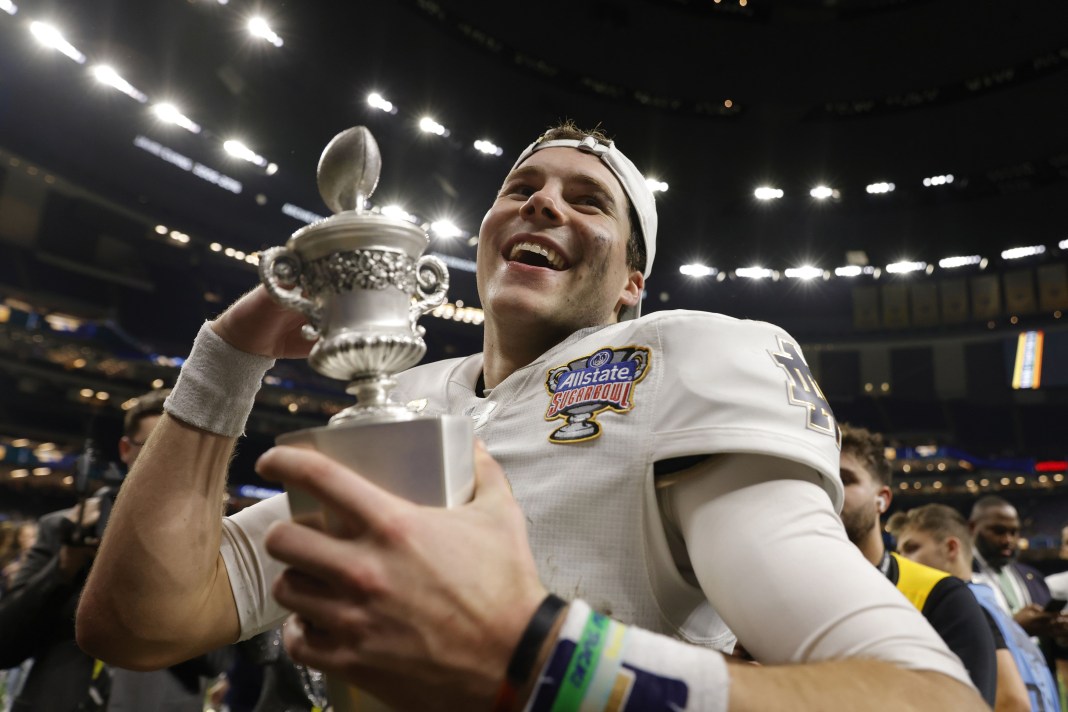 Notre Dame quarterback Riley Leonard (13) celebrates with fans in the stands after the victory over the Georgia Bulldogs at Caesars Superdome on January 2, 2025