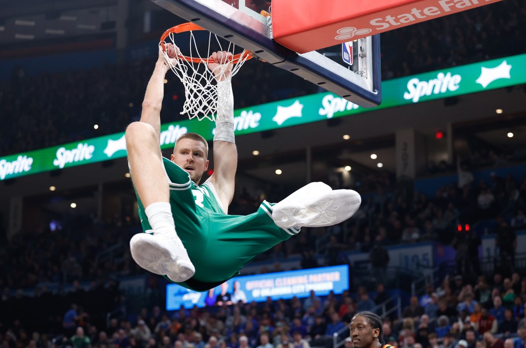 Boston Celtics center Kristaps Porzingis (8) dunks during the second quarter against the Oklahoma City Thunder at Paycom Center on January 5, 2025