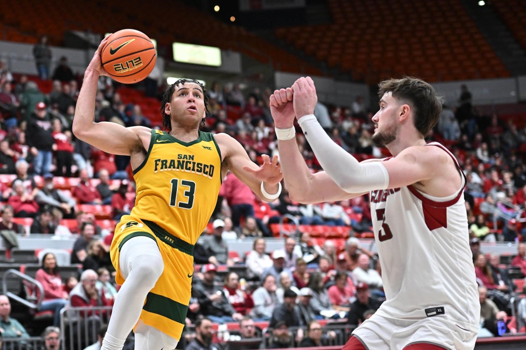 San Francisco Dons guard Robby Beasley (13) attempts a shot against Washington State Cougars forward Ethan Price (3) during the second half at Beasley Coliseum on January 4, 2025