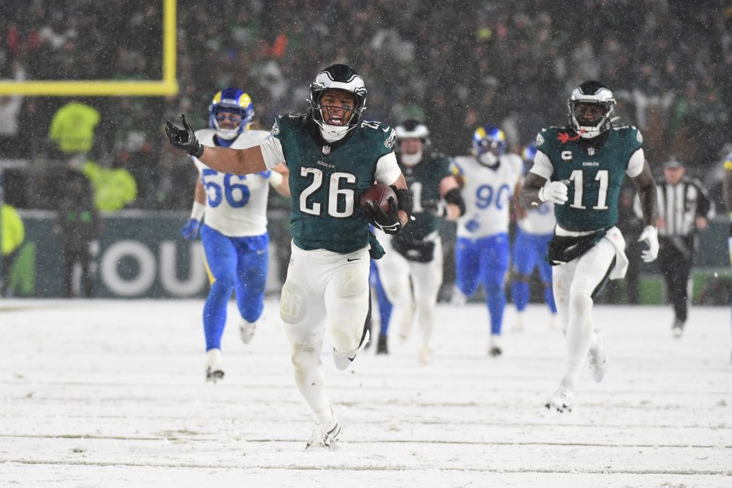 Eagles star Saquon Barkley celebrates on his way to scoring a touchdown against the Rams in the NFC Divisional Round.