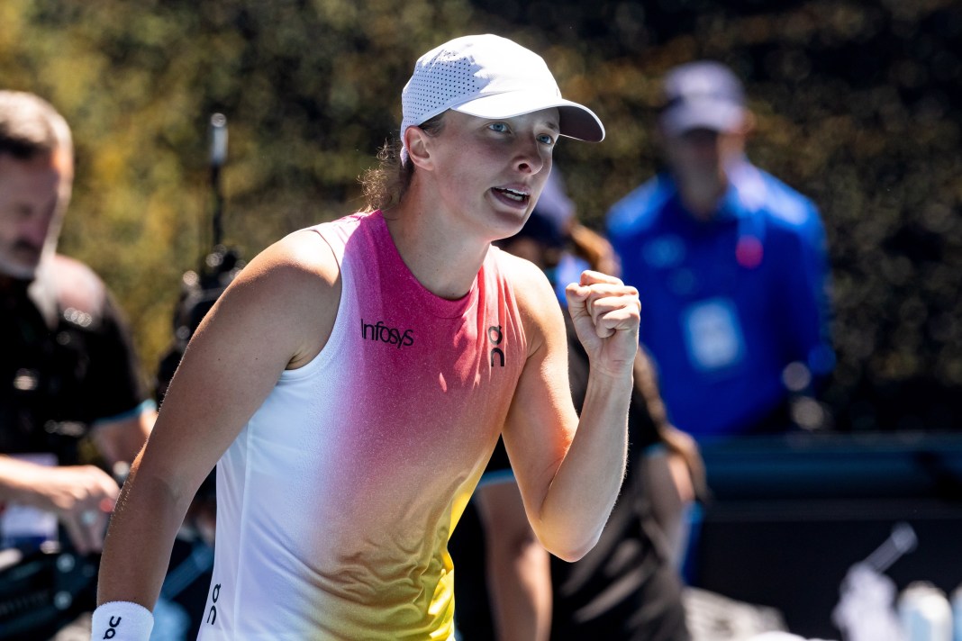 Iga Swiatek celebrates a point against Emma Navarro in the 2025 Australian Open quarterfinals.