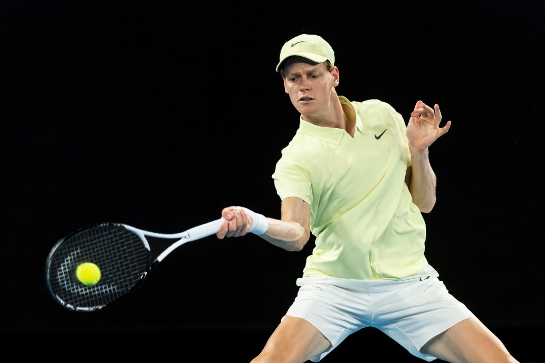 Jannik Sinner hits a forehand against Alex de Minaur in the quarterfinals of the 2025 Australian Open.