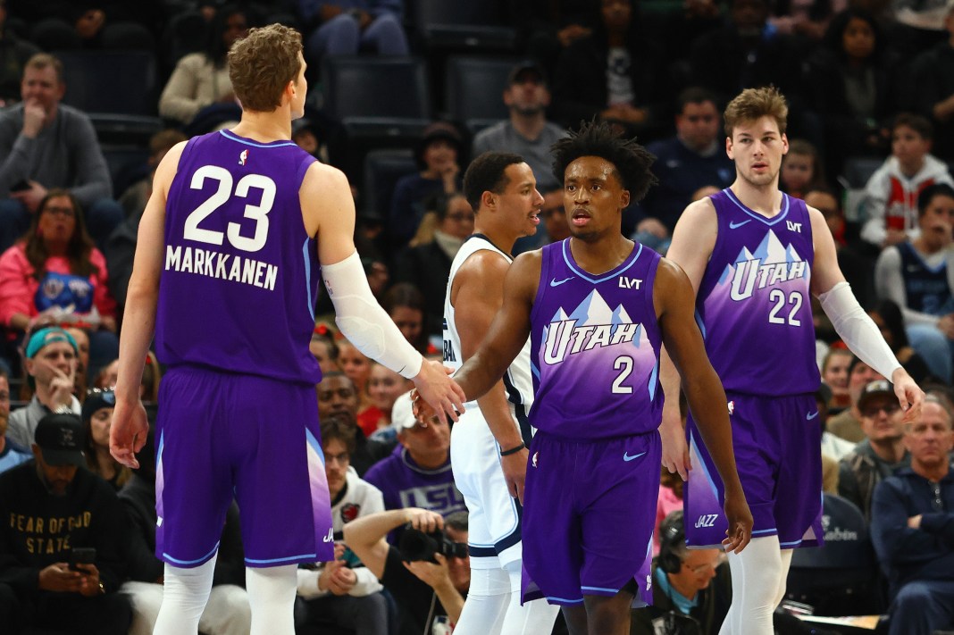 Jazz guard Collin Sexton high fives forward Lauri Markkanen during a meeting with the Grizzlies in the 2024-25 NBA season.