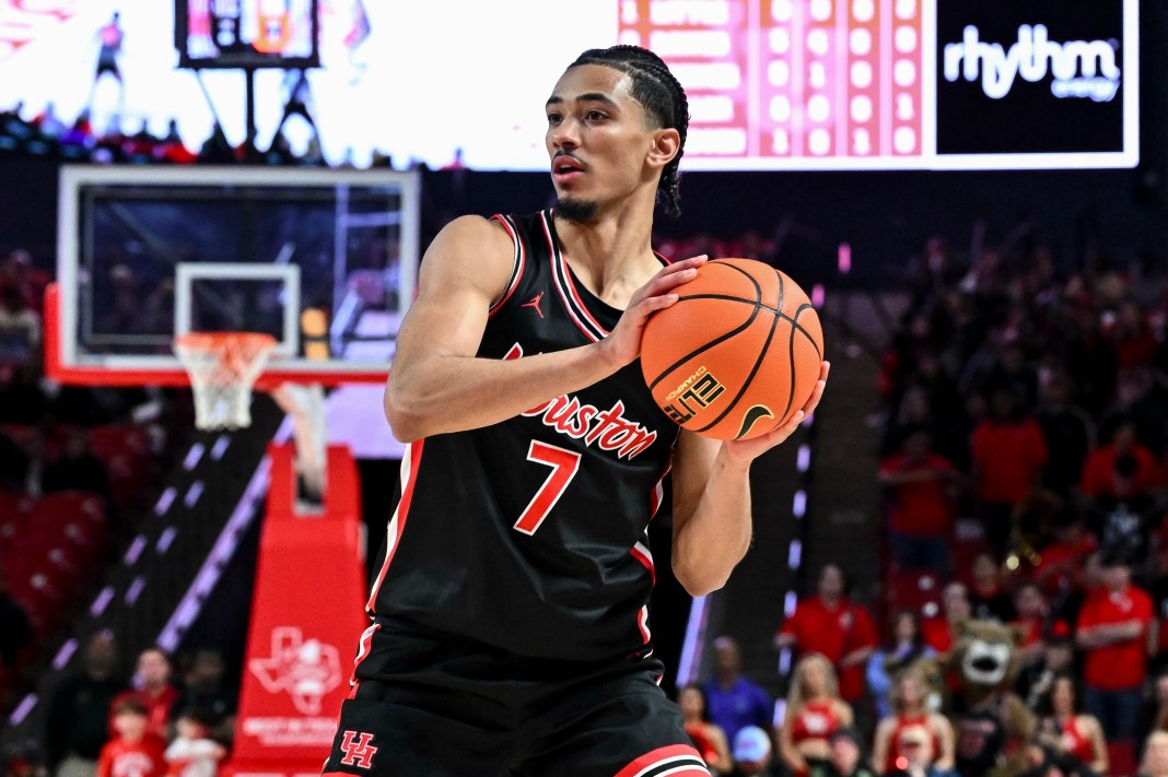 Houston Cougars guard Milos Uzan (7) looks to pass the ball during the second half against the Utah Utes at Fertitta Center on January 22, 2025. The Cougars won 70-36