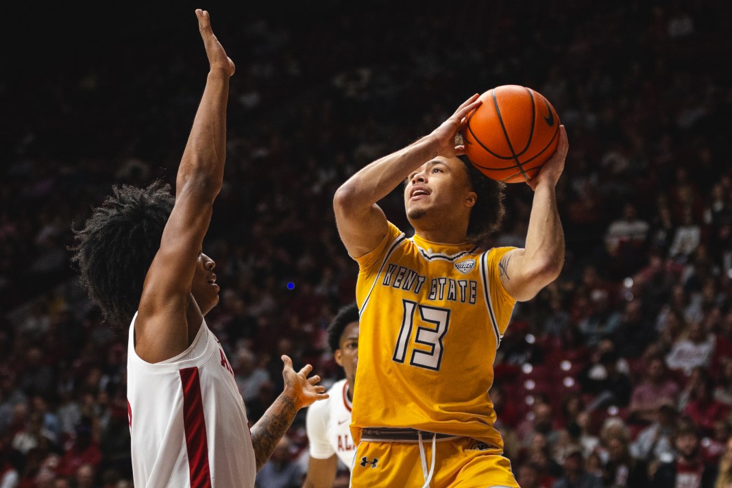 Kent State Golden Flashes guard Jalen Sullinger (13) shoots the ball against Alabama Crimson Tide guard Aden Holloway (2) during the second half at Coleman Coliseum on December 22, 2024