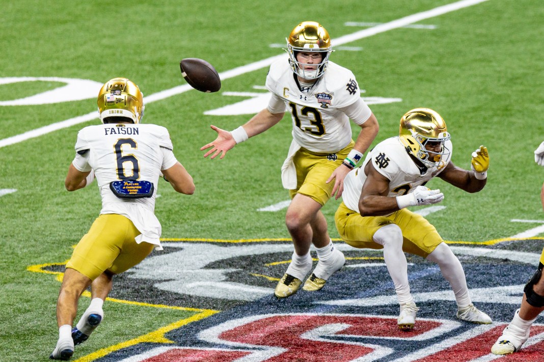 Notre Dame quarterback Riley Leonard (13) flips the ball to wide receiver Jordan Faison (6) during a play against the Georgia Bulldogs in the second half at Caesars Superdome on January 2, 2025.