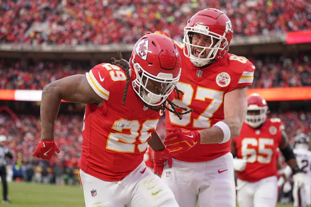 Kansas City Chiefs running back Kareem Hunt (29) celebrates with tight end Travis Kelce (87) after scoring a touchdown against the Houston Texans during the first half of the 2025 AFC Divisional Round at GEHA Field at Arrowhead Stadium on January 18, 2025.