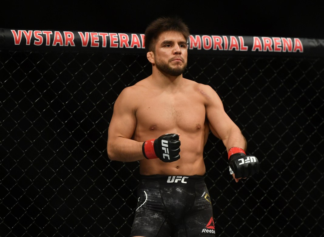 Henry Cejudo (red gloves) prepares before his fight against Dominick Cruz (blue gloves) during UFC 249 at VyStar Veterans Memorial Arena in Jacksonville, Florida, on May 9, 2020.