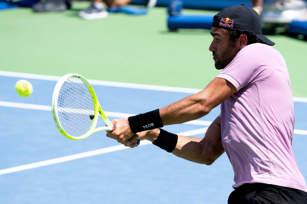 Matteo Berrettini hits a backhand against Holger Rune at the 2025 Australian Open.