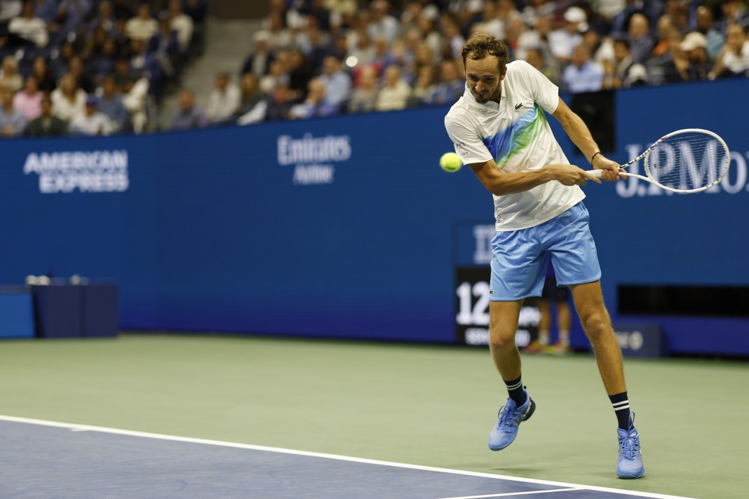 Daniil Medvedev hits a backhand in a meeting with Jannik Sinner at the 2024 US Open.