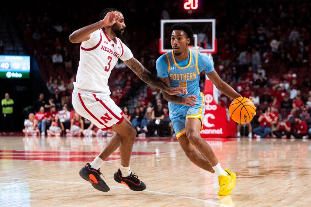 University Jaguars guard Michael Jacobs (2) drives to the basket against Nebraska Cornhuskers guard Brice Williams (3) during the second half at Pinnacle Bank Arena on December 30, 2024