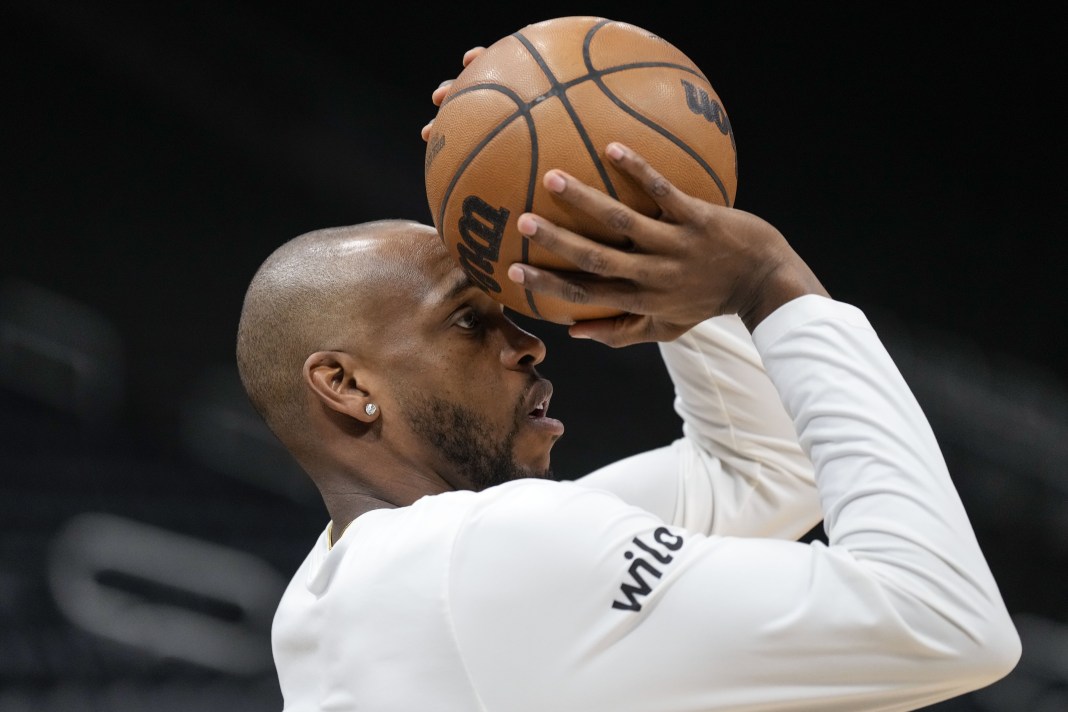 Wizards forward Khris Middleton shoots a shot in warmups during the 2024-25 NBA season.