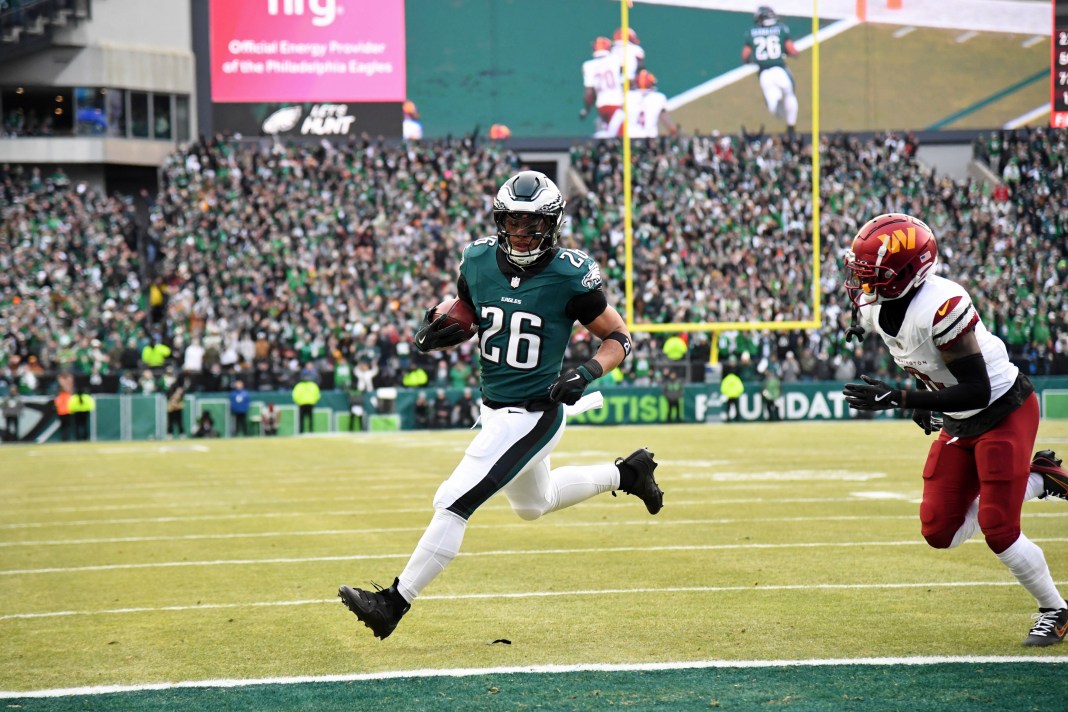 Philadelphia Eagles running back Saquon Barkley (26) runs with the ball for a touchdown during the first half of the NFC Championship game against the Washington Commanders at Lincoln Financial Field on January 26, 2025