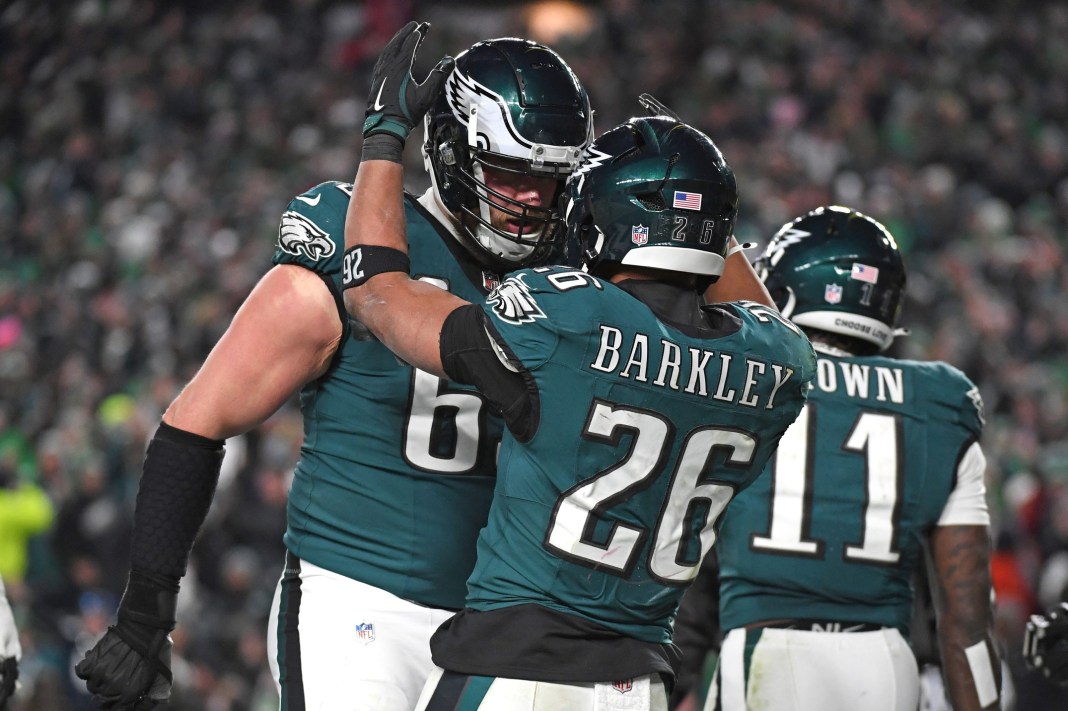 Eagles star running back Saquon Barkley celebrates a touchdown with tackle Lane Johnson during the NFC Championship Game.