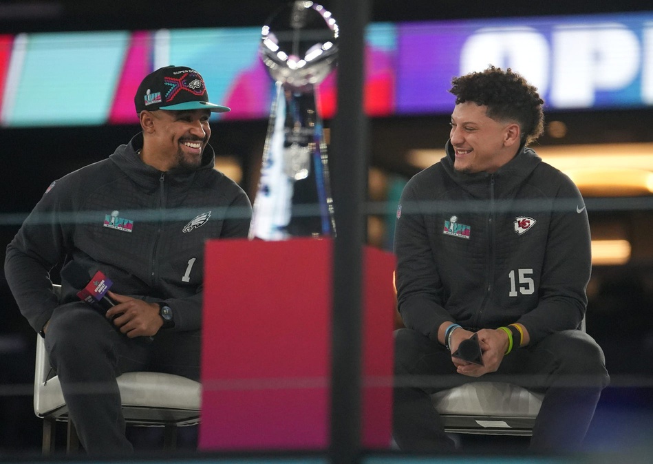 Kansas City Chiefs quarterback Patrick Mahomes (right) and Philadelphia Eagles quarterback Jalen Hurts (left) share the stage during Super Bowl 57 opening night in downtown Phoenix on February 6, 2023