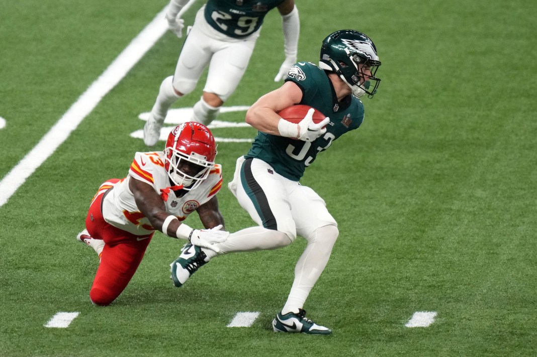 Philadelphia Eagles cornerback Cooper DeJean (33) returns a punt against Kansas City Chiefs safety Nazeeh Johnson (13) during the second quarter of Super Bowl LIX at Caesars Superdome on February 9, 2025