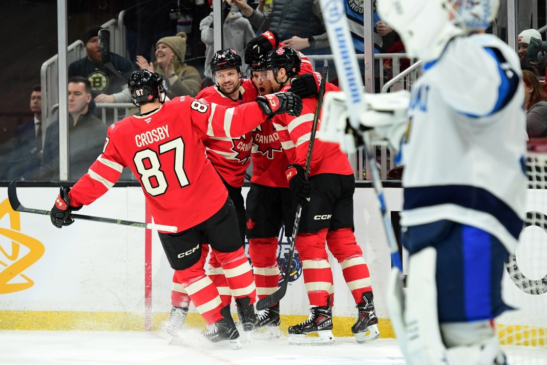 Team Canada forward Sidney Crosby (87) celebrates a goal by forward Nathan MacKinnon (29) during the first period of a 4 Nations Face-Off ice hockey game against Team Finland at TD Garden on February 17, 2025.