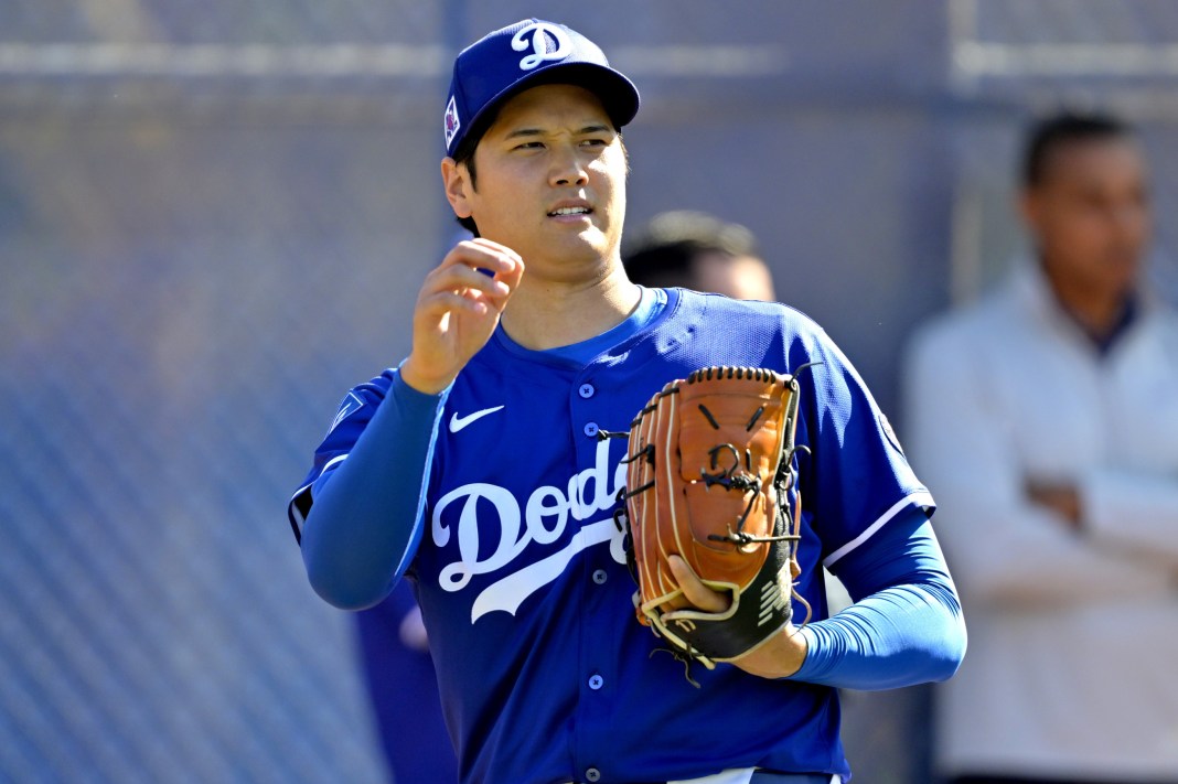 Los Angeles Dodgers designated hitter Shohei Ohtani (17) throws a bullpen session during spring training workouts at Camelback Ranch on February 18, 2025.