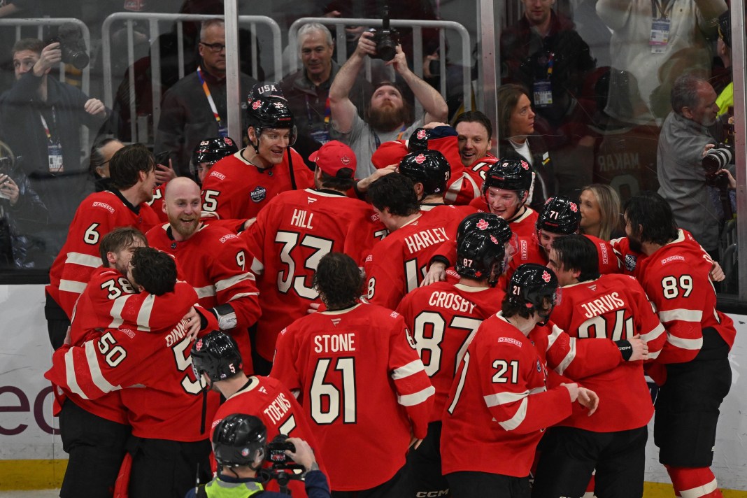 Team Canada celebrates forward Connor McDavid's (97) goal in overtime to win against Team USA during the 4 Nations Face-Off ice hockey championship game at TD Garden on February 20, 2025.