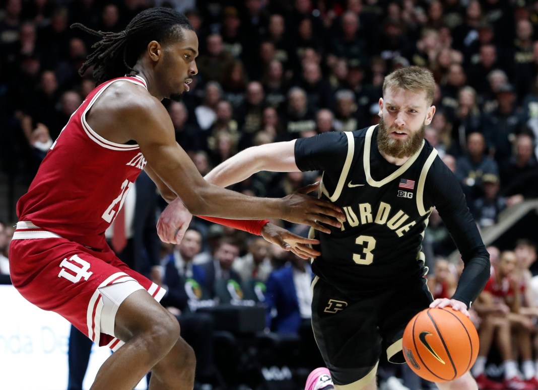 Indiana Hoosiers forward Mackenzie Mgbako (21) defends Purdue Boilermakers guard Braden Smith (3) during the NCAA men’s basketball game at Mackey Arena in West Lafayette, Indiana, on January 31, 2025. Purdue Boilermakers won 81-76.